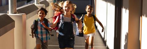 Kids running down a hallway